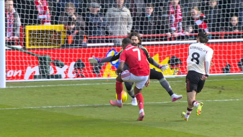 Liverpool goalkeeper Alisson Becker diving to make a save against Nottingham Forest