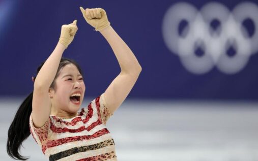 Japanese figure skater Ami Nakai performing on the ice during the women's short program at Milan-Cortina 2026