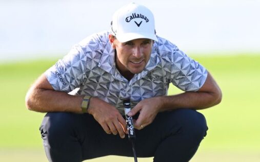 Golfer Andrea Pavan wearing a cap and golf attire while looking down the fairway during a tournament