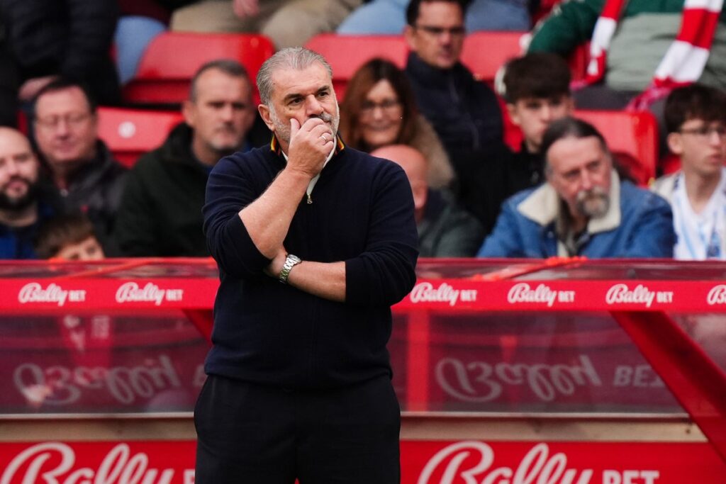 Ange Postecoglou looking pensive on the touchline during a football match