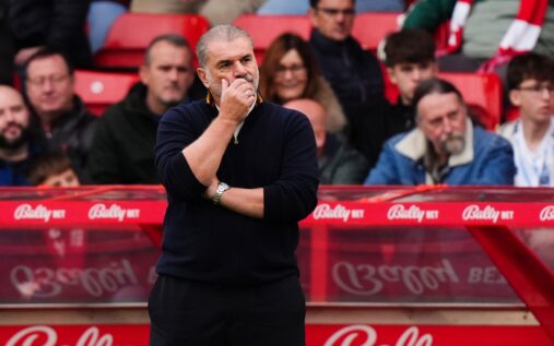 Ange Postecoglou looking pensive on the touchline during a football match