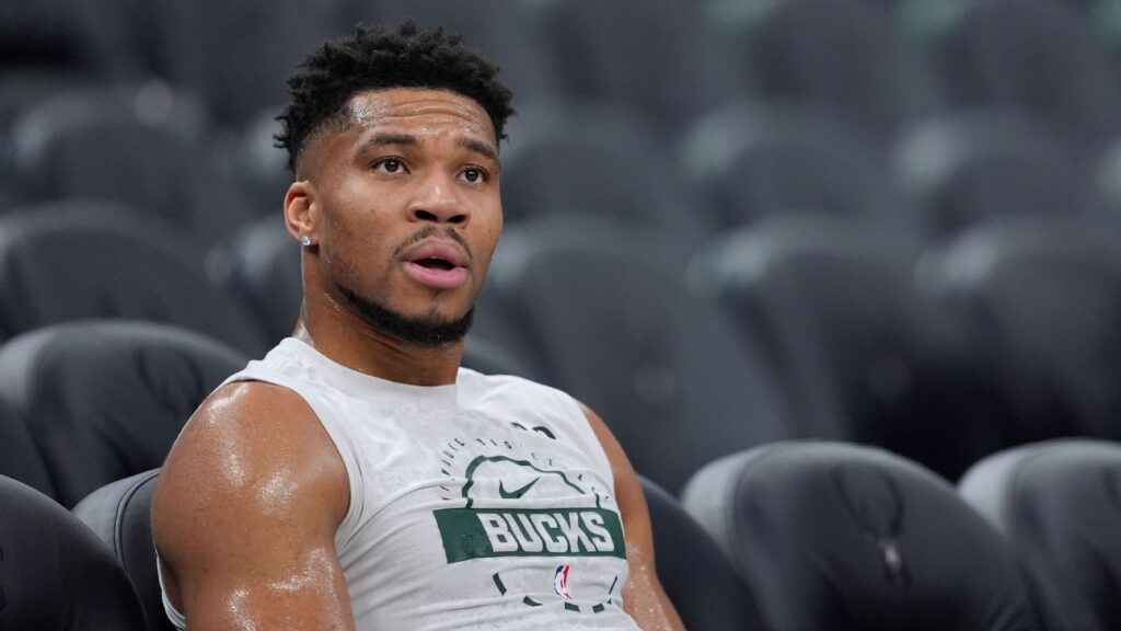 Giannis Antetokounmpo in a Milwaukee Bucks jersey looking focused on the court during an NBA game