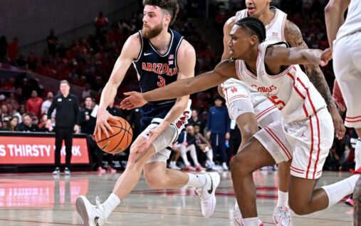 Arizona Wildcats player Anthony Dell'Orso driving to the basket against Houston defence