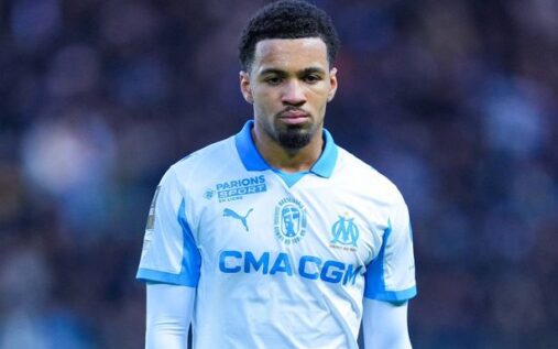 Ethan Nwaneri warming up in an Arsenal training kit before his loan move to Marseille