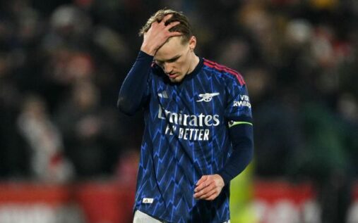 Martin Odegaard clapping the Arsenal fans with a dejected expression after the draw against Brentford