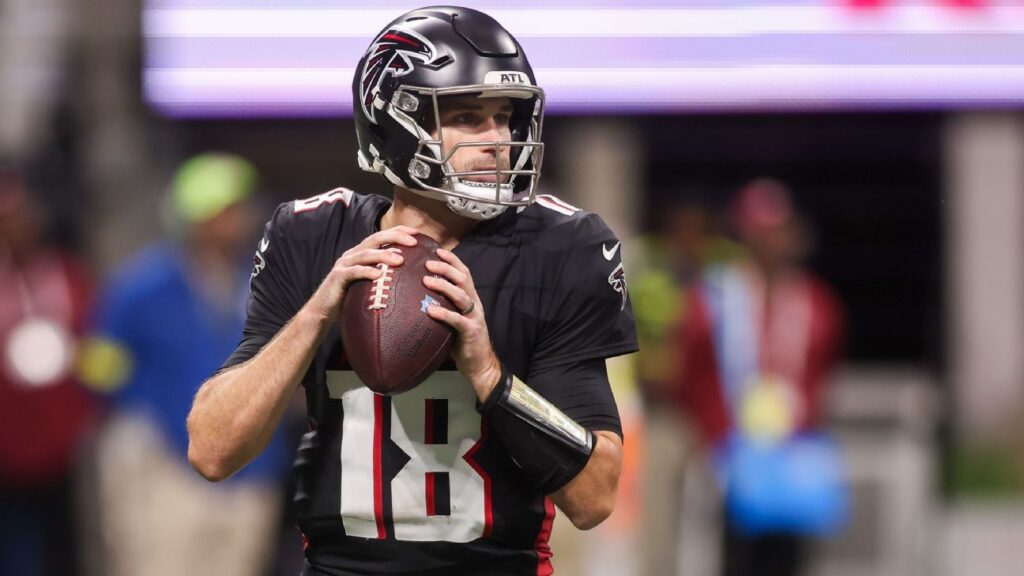 Kirk Cousins looking on from the sidelines in an Atlanta Falcons uniform