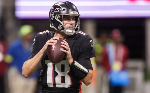 Kirk Cousins looking on from the sidelines in an Atlanta Falcons uniform