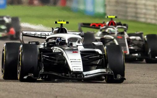 The Audi F1 team logo displayed alongside the Cadillac racing emblem