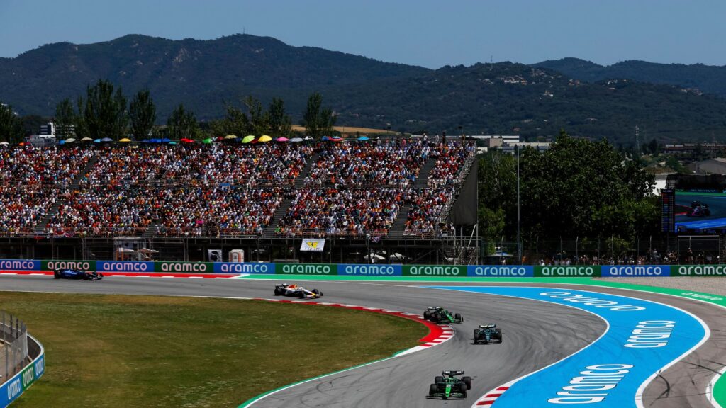 Formula 1 cars racing through the high-speed corners of the Circuit de Barcelona-Catalunya in Spain