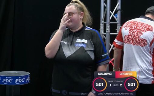 Beau Greaves throwing a dart at the oche during a PDC tournament