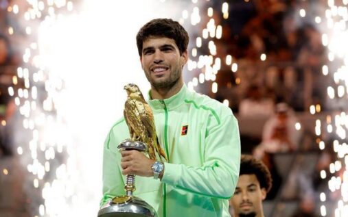 Carlos Alcaraz holding the Qatar Open trophy in Doha after defeating Arthur Fils