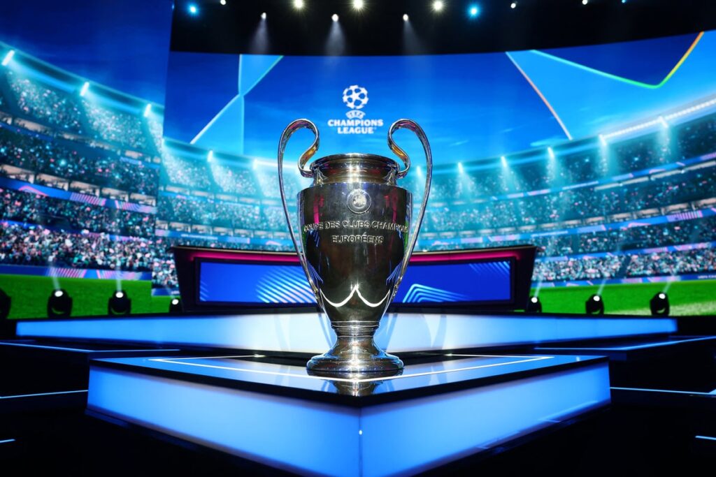 The UEFA Champions League trophy displayed on a podium during a draw ceremony in Nyon