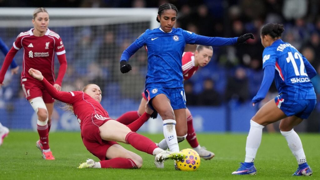 Chelsea Women players celebrating a goal against Liverpool at Kingsmeadow