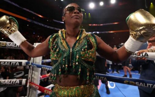 Undisputed heavyweight champion Claressa Shields holding her championship belts