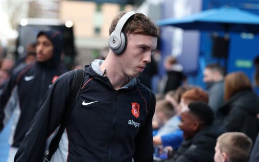 Cole Palmer looking focused on the pitch while wearing a Chelsea kit during a Premier League match