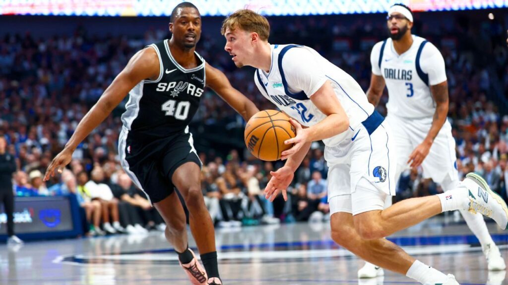 Cooper Flagg in action for the Dallas Mavericks during his NBA debut game against the San Antonio Spurs