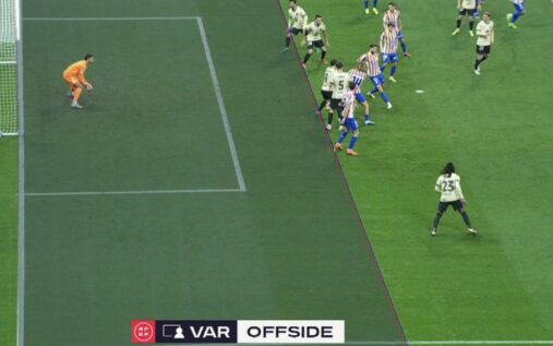 The referee signals for a VAR review inside the Metropolitano Stadium during Atletico Madrid vs Barcelona