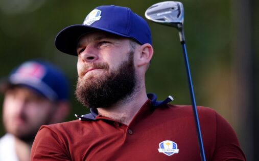Tyrrell Hatton lining up a putt on the green during a DP World Tour tournament