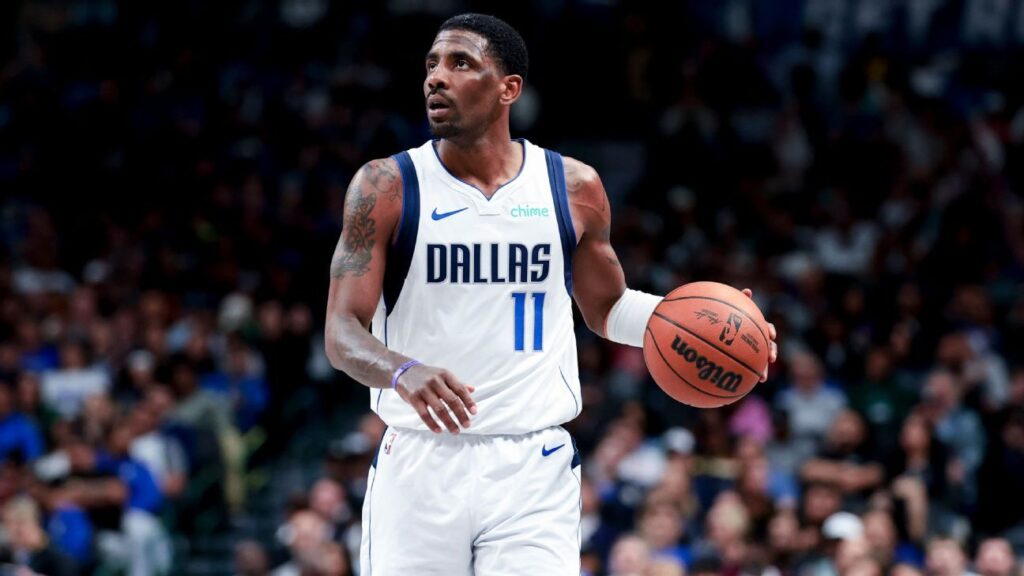 Dallas Mavericks guard Kyrie Irving looking focused on the court during an NBA game