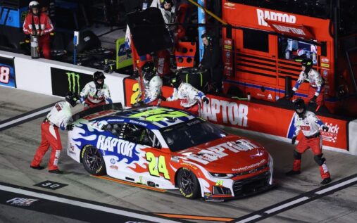 William Byron standing on the grid next to his No. 24 Chevrolet at Daytona International Speedway