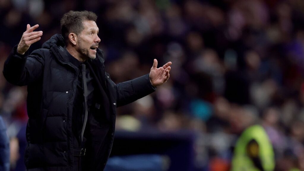 Atlético Madrid manager Diego Simeone looking concerned on the touchline during a match