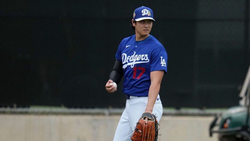 Shohei Ohtani pitching in a Dodgers uniform during a spring training bullpen session