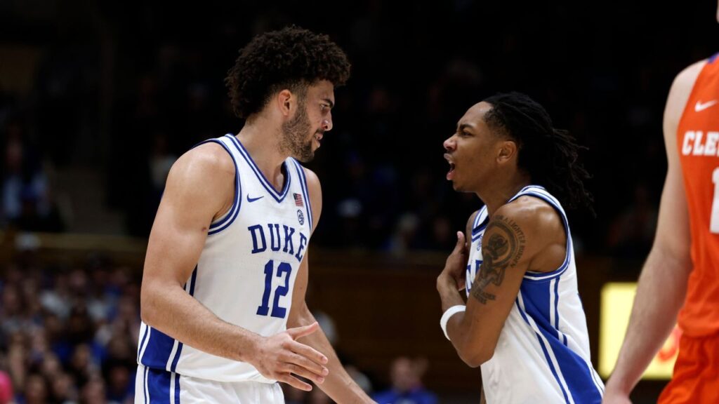 Duke Blue Devils head coach Jon Scheyer giving instructions to Cameron Boozer during a game