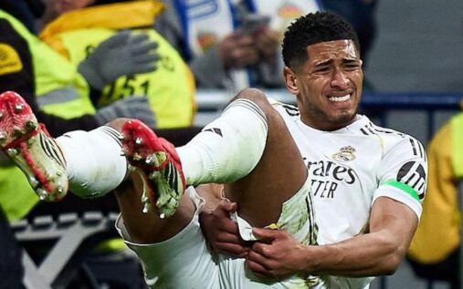 Jude Bellingham holding his hamstring while playing for Real Madrid