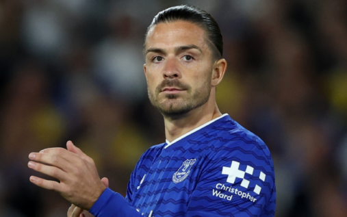 Jack Grealish clapping the fans while wearing an Everton shirt during a Premier League match