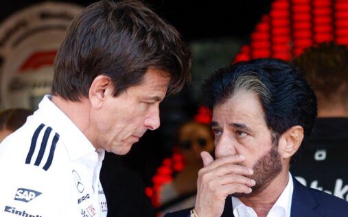 F1 cars driving on the track at the Bahrain International Circuit during pre-season testing