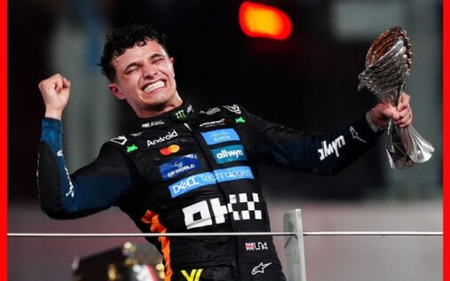 Lando Norris celebrating a race victory in his McLaren team kit