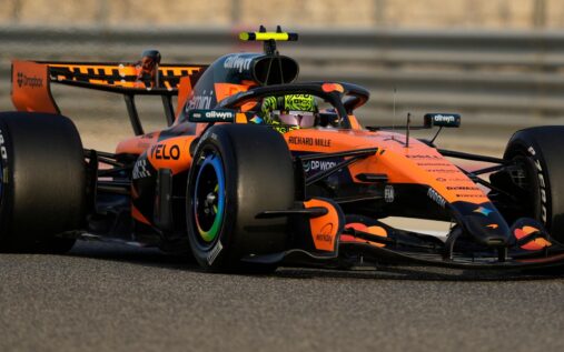 Formula 1 cars driving on the track at the Bahrain International Circuit during pre-season testing