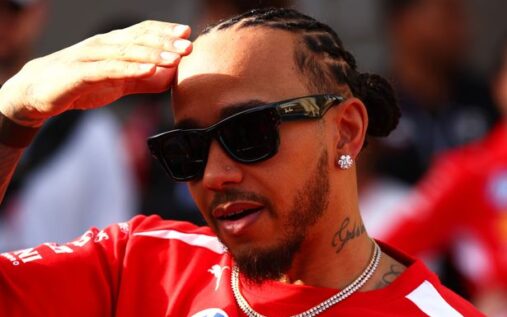 Lewis Hamilton in Ferrari team wear looking focused during a Formula 1 press conference