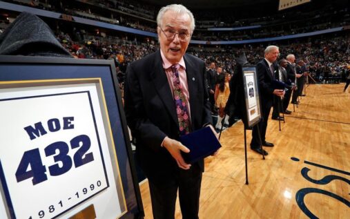 Doug Moe coaching the Denver Nuggets from the sidelines during a game in the 1980s