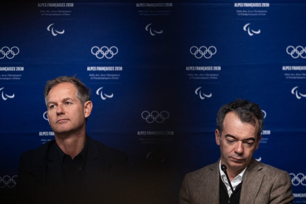 Cyril Linette and Edgar Grospiron at a press event for the French Alps 2030 Winter Olympics bid
