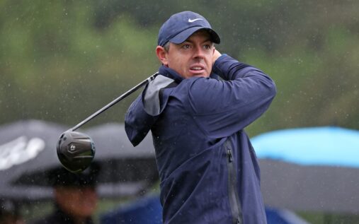 Rory McIlroy playing a shot in wet conditions at the Genesis Invitational