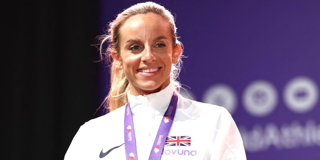 Georgia Bell competing on the track in a Team GB vest during a 1500m race