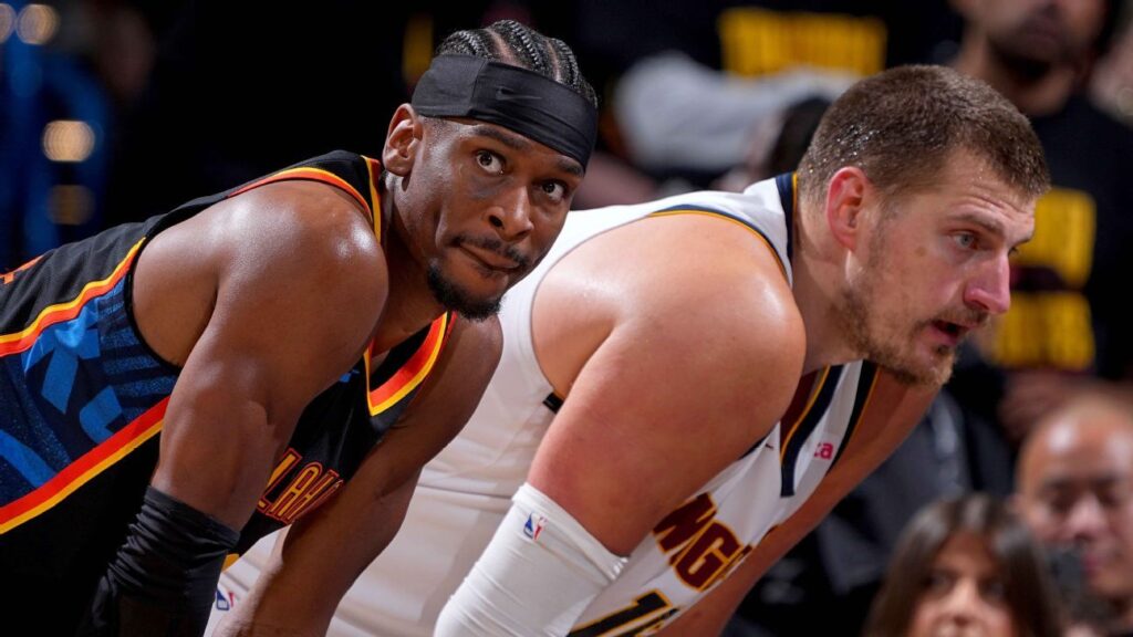 Shai Gilgeous-Alexander dribbling the ball for the Oklahoma City Thunder during an NBA game