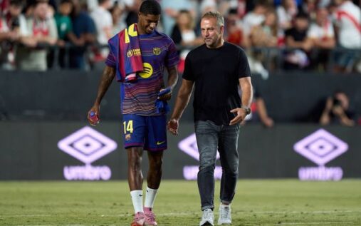 Barcelona manager Hansi Flick gesturing from the touchline during a La Liga match