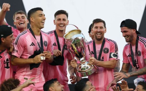 Lionel Messi celebrating a goal for Inter Miami in their pink home kit during a match