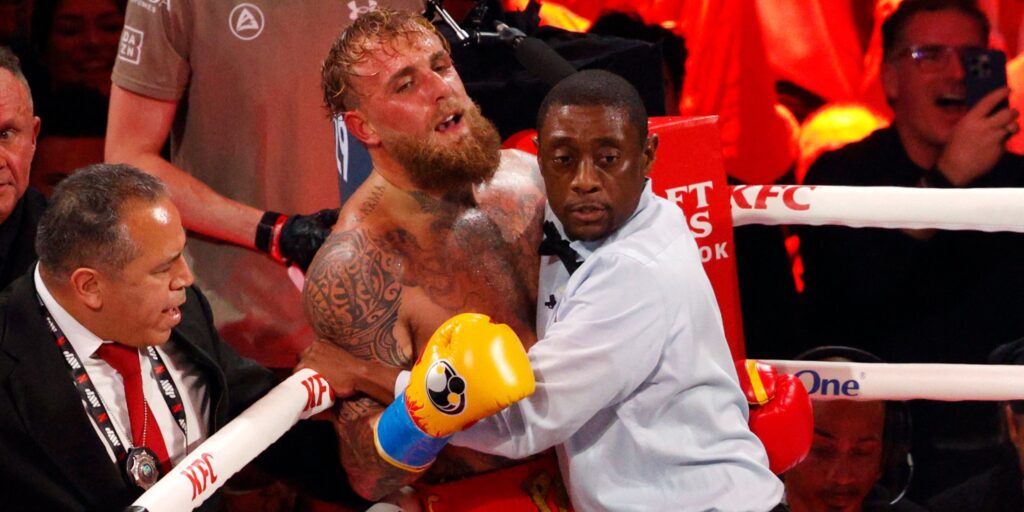 Jake Paul in the boxing ring wearing gloves and shorts