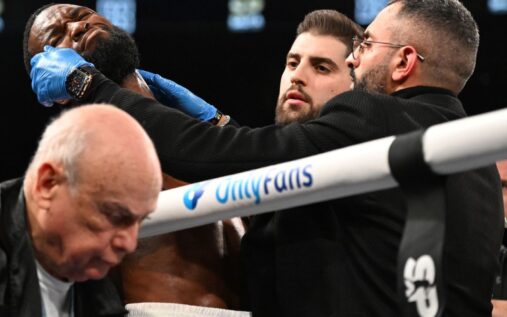Medical staff attending to Joe George Jr in the boxing ring corner