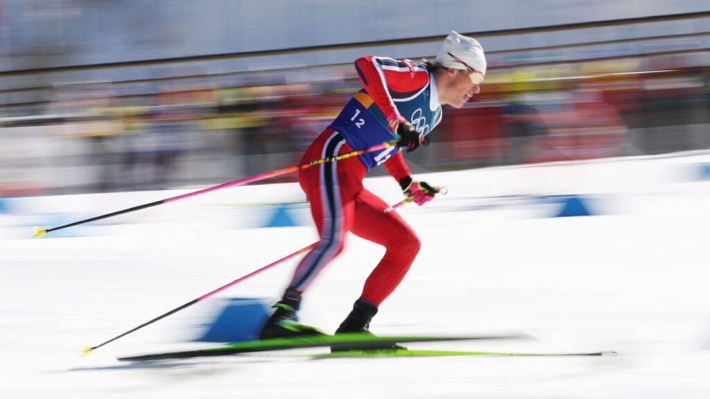 Johannes Hoesflot Klaebo celebrating with a gold medal after the team sprint event at the Milan Cortina Winter Olympics