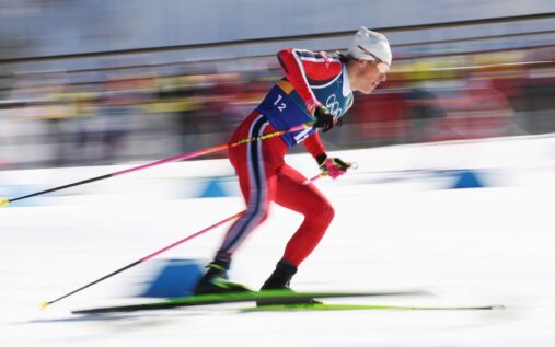 Johannes Hoesflot Klaebo celebrating with a gold medal after the team sprint event at the Milan Cortina Winter Olympics