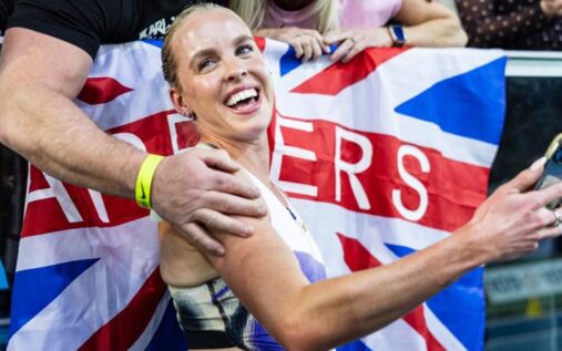 Keely Hodgkinson celebrating on the track after an 800m race victory