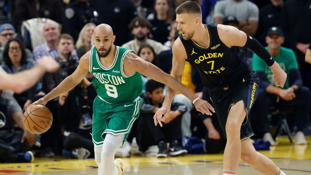 Kristaps Porzingis shooting the ball during his Golden State Warriors debut against the Boston Celtics