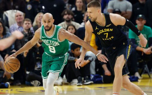Kristaps Porzingis shooting the ball during his Golden State Warriors debut against the Boston Celtics