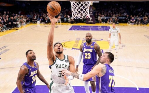 LeBron James and Luka Doncic talking on the court during a Los Angeles Lakers game