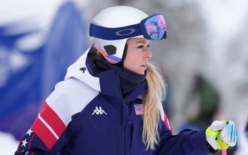 Lindsey Vonn looking serious while wearing Team USA ski gear