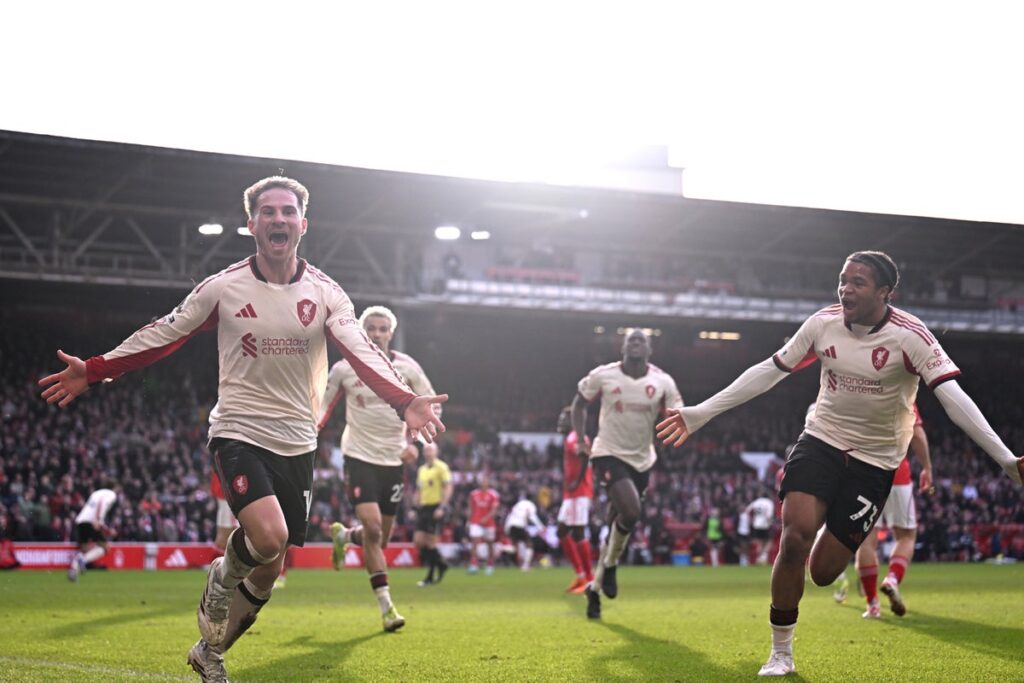 Liverpool manager Arne Slot gesturing to his players from the touchline during a Premier League match